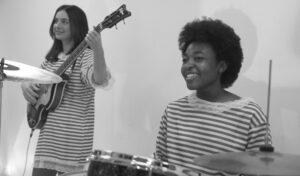 B&W pic of drumming and bass